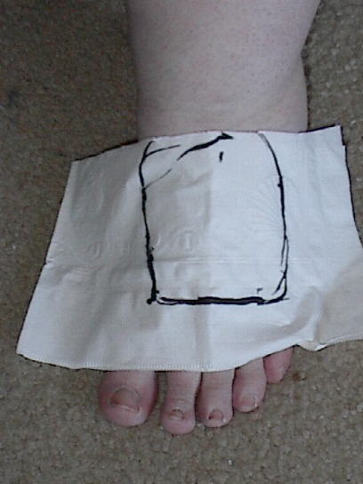 mark the wig area on a napkin on your foot